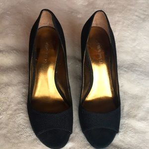 Textured black wedges with brown heels